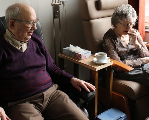 elderly couple sitting next to each other, signs you need assisted living