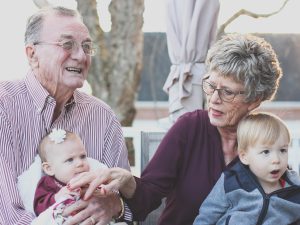 what is independent living, grandparents holding baby and small child